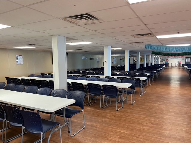 Empty Pecos facility, a vast room standing unused, symbolizing savings for taxpayers.